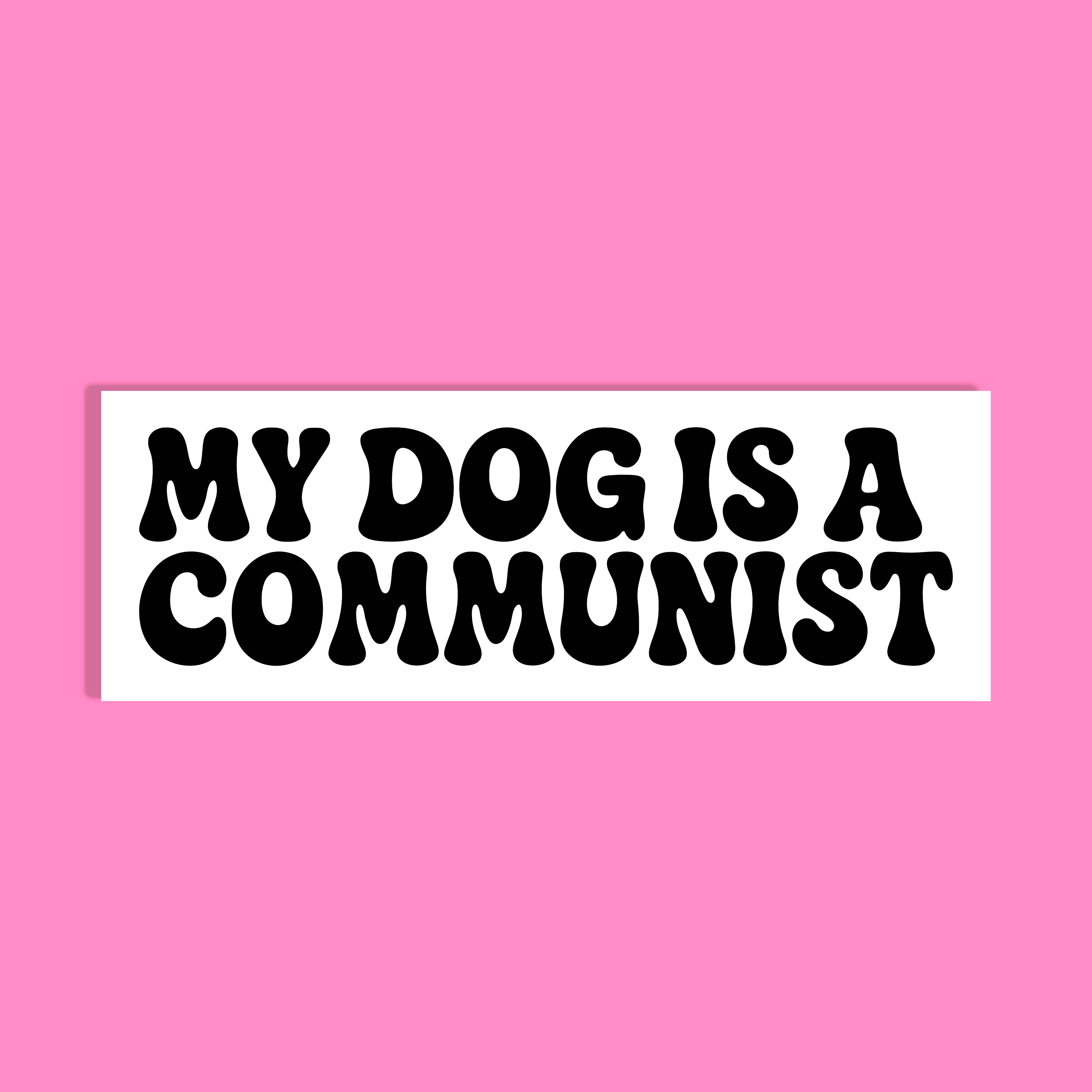 A rectangular white background with bold black text reading 'MY DOG IS A COMMUNIST' centered on a solid pink background.