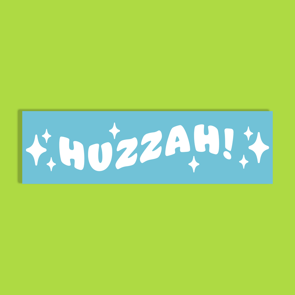 A rectangular light blue background with the word 'HUZZAH!' in bold white letters and white sparkle graphics, shown on a bright lime green background.