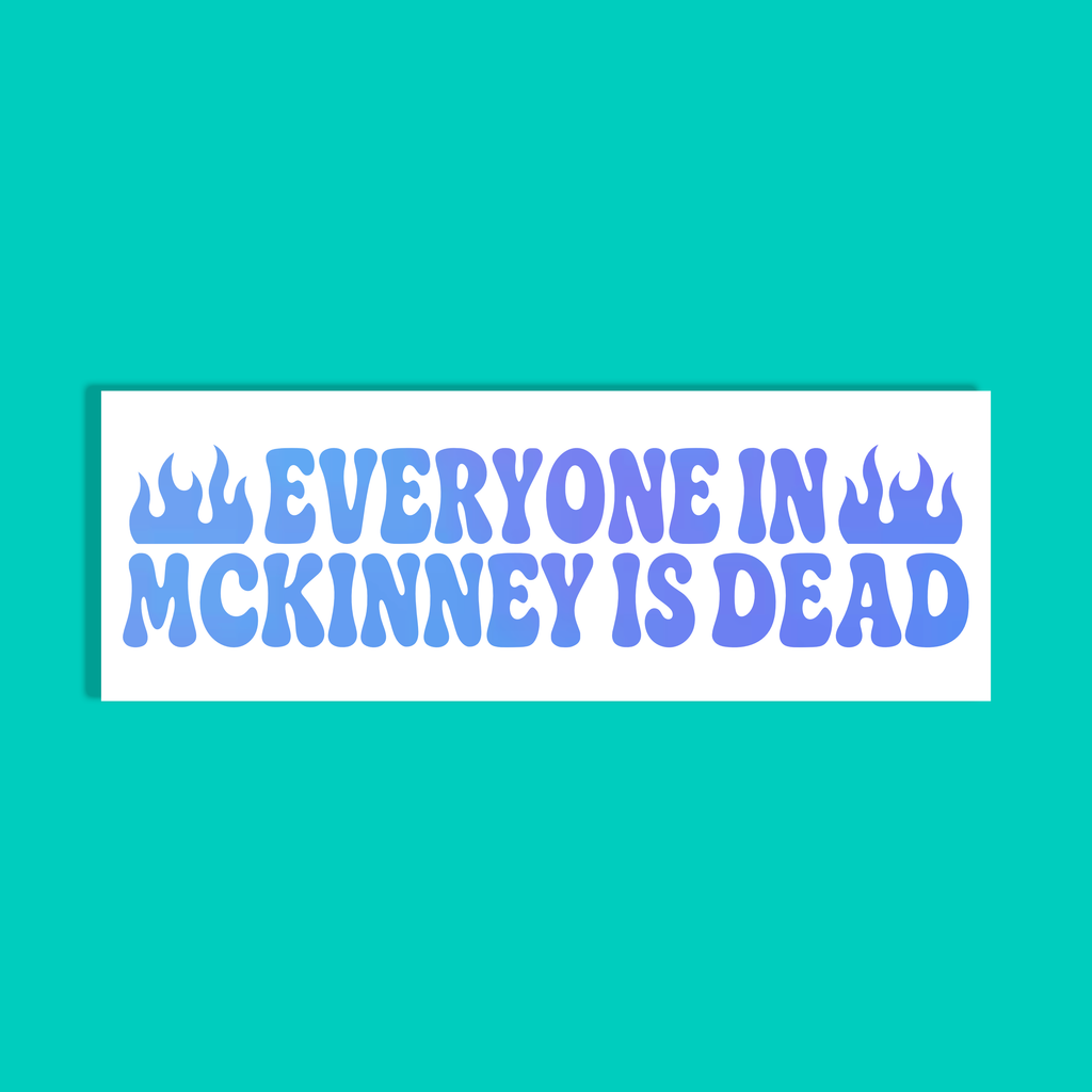 A rectangular white sticker or sign with the phrase “EVERYONE IN MCKINNEY IS DEAD” in bold blue lettering, flanked by two small flame icons, shown on a solid turquoise background.