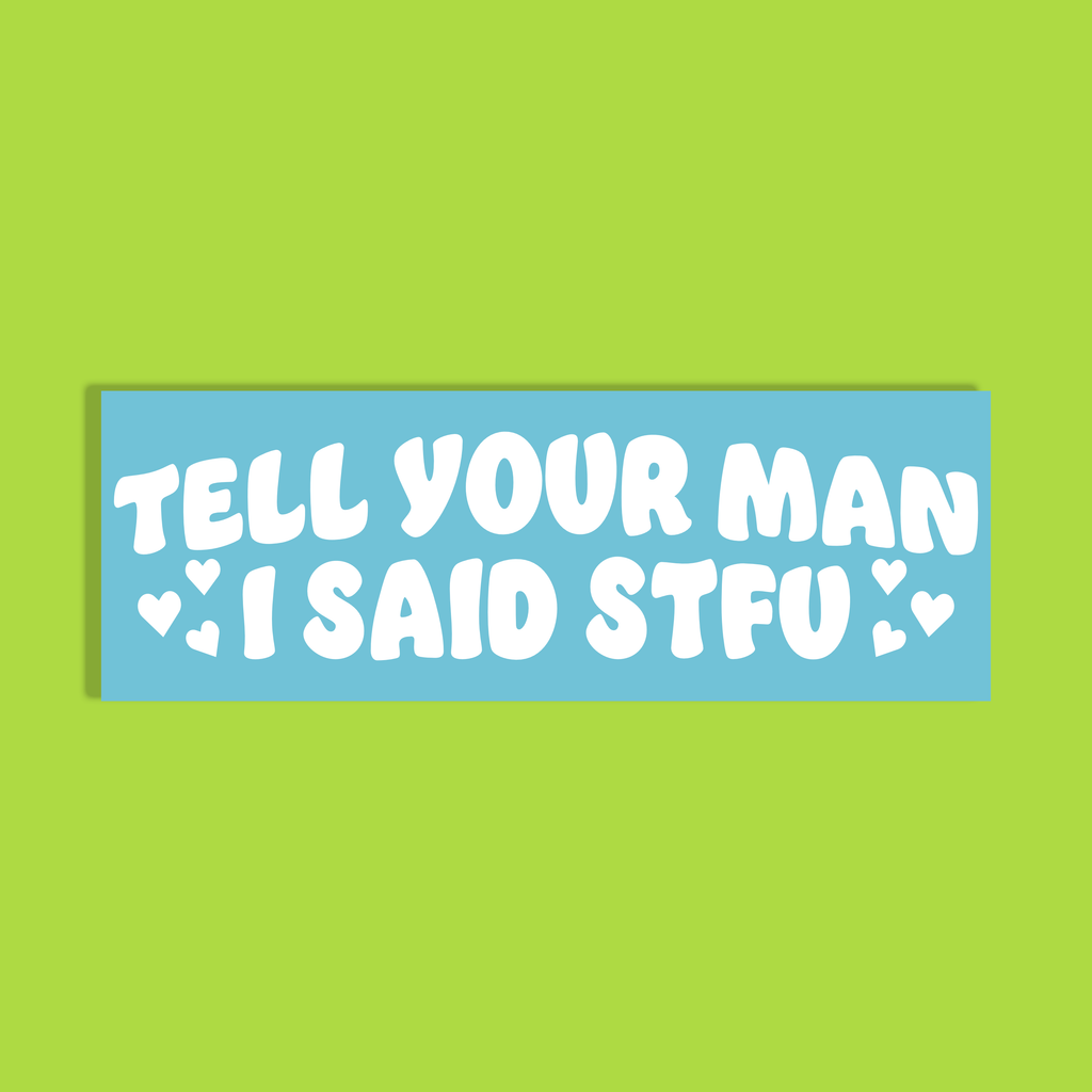 A rectangular bumper sticker with a light blue background and bold white text that reads 'TELL YOUR MAN I SAID STFU' with small heart icons, shown on a solid lime green background.